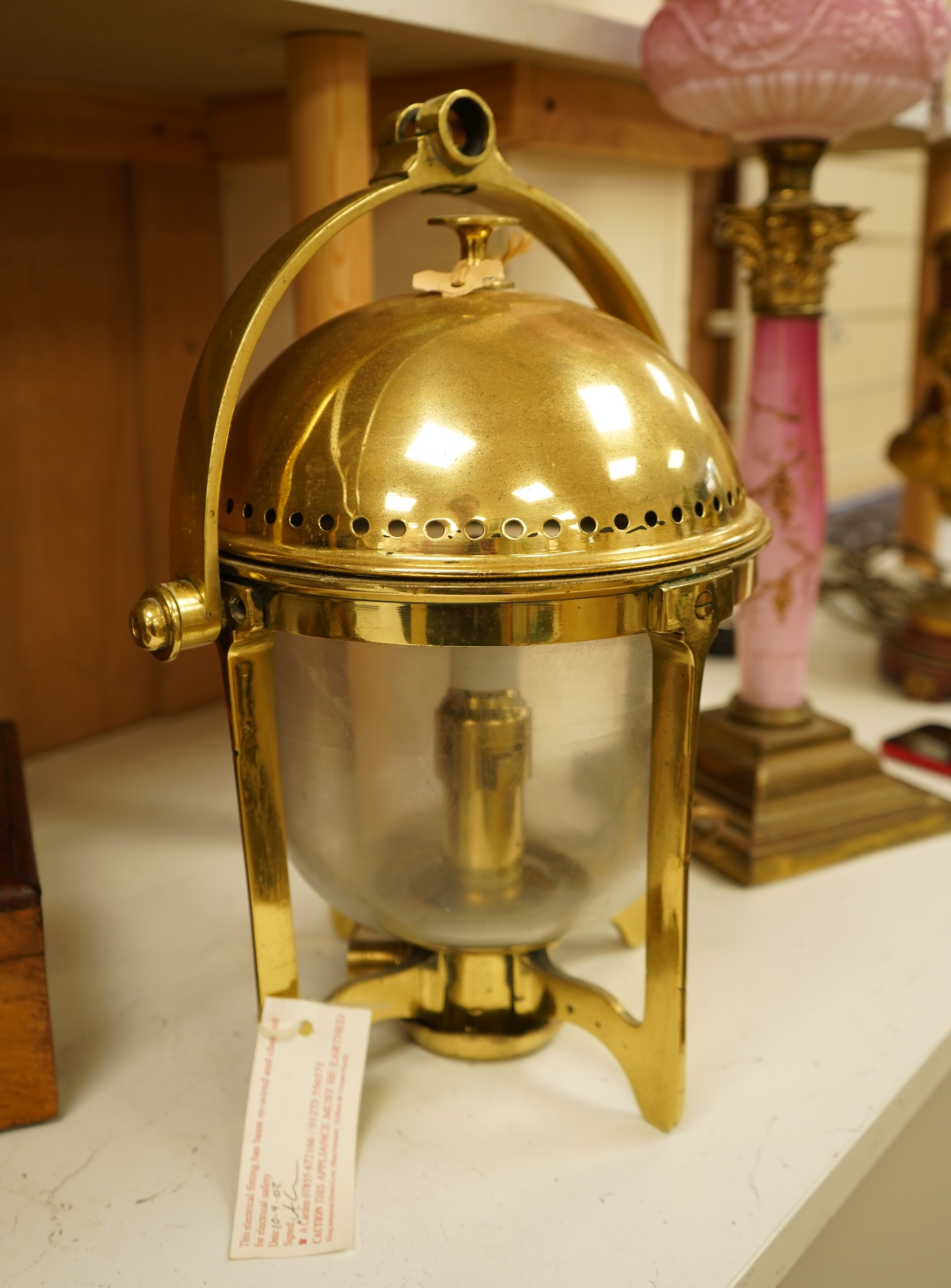 A brass ship's lamp on gimble, 41cm high